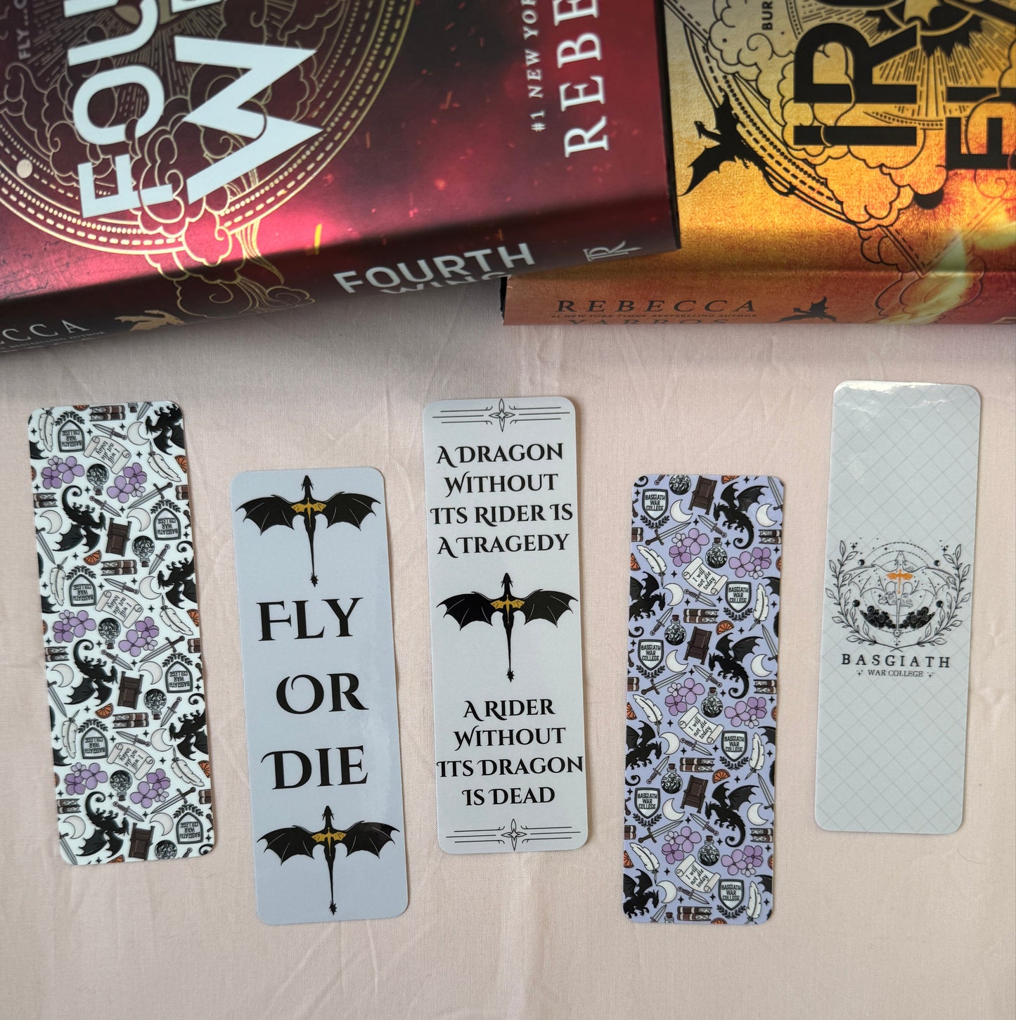 Bundle of all 5 Fourth Wing Bookmarks including purple and white pattern of fourth wing icons, basgiath war college, fly or die and a rider without its dragon is dead quote bookmarks