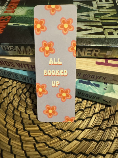 Retro Floral Bookmark with quote "All Booked Up" with orange retro inspired flowers on a light blue background