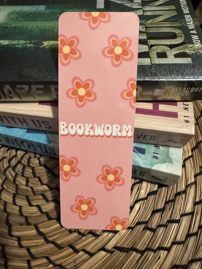 Retro Floral Bookmark with quote "Bookworm" with orange and pink retro flowers on a light pink background