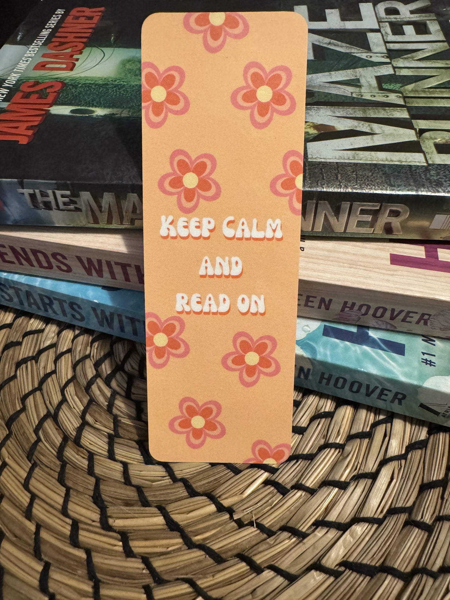 Retro Floral Bookmark with quote "Keep Calm And Read On" with orange and pink retro flowers on a light orange background